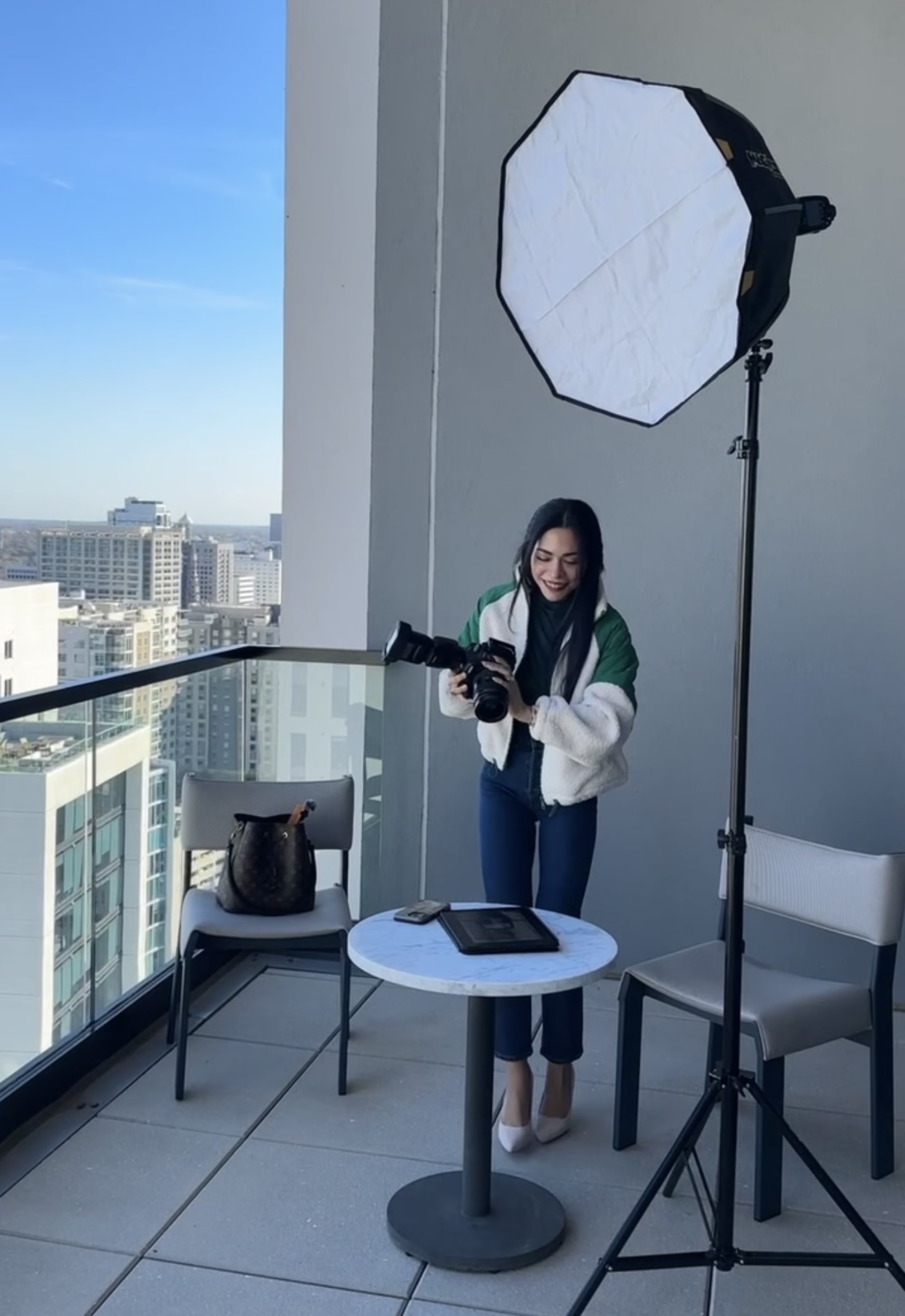 Hannah reviewing footage on rooftop shoot